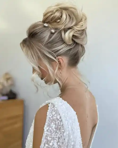 Classic High Bun with Curtain Bangs